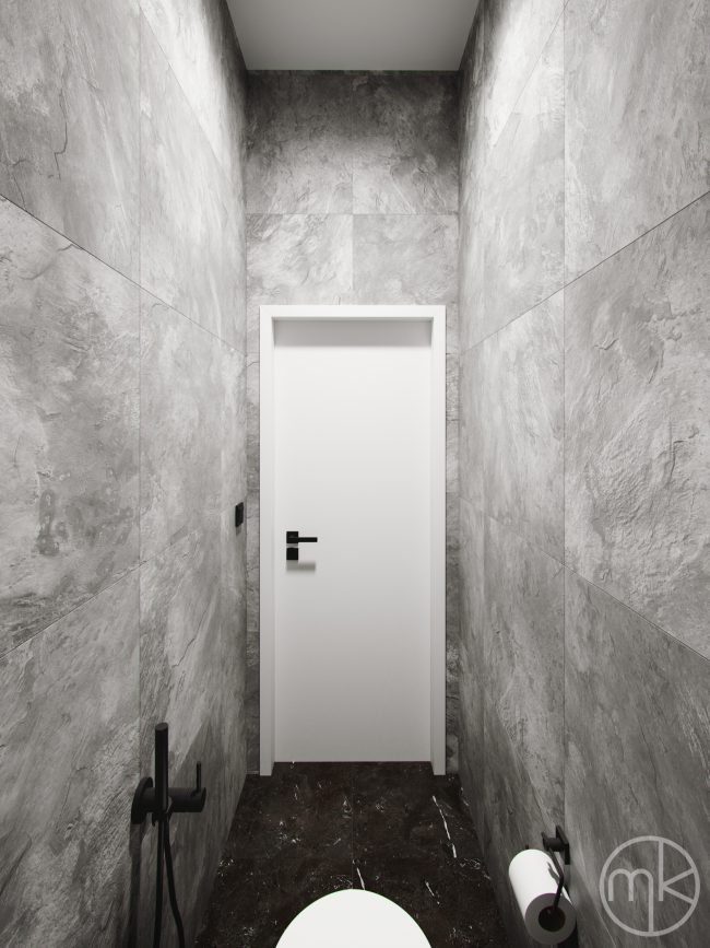 Bílé dveře na moderním černobílém záchodu